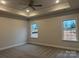 Bright bedroom with carpet, ceiling fan and two windows at 104 Kerr Walk Dr # 14, Statesville, NC 28677