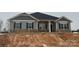 New gray house with stone accents, two-car garage, and landscaping at 104 Kerr Walk Dr # 14, Statesville, NC 28677