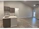 Modern kitchen with an island, stainless steel appliances, and hardwood floors at 104 Kerr Walk Dr # 14, Statesville, NC 28677