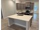 Modern kitchen with gray cabinets, quartz countertops and an island at 104 Kerr Walk Dr # 14, Statesville, NC 28677