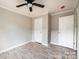 Well-lit bedroom with wood-look flooring and ceiling fan at 114 River Ridge Ln, Hickory, NC 28601