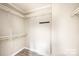 Spacious closet with ample shelving and hanging rods at 114 River Ridge Ln, Hickory, NC 28601