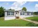 Gray mobile home with stone accents and a small front porch at 114 River Ridge Ln, Hickory, NC 28601