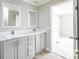 Double vanity bathroom with gray cabinets and mirrors at 116 River Ridge Ln, Hickory, NC 28601