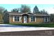 Single-story home with brown siding and a driveway at 116 River Ridge Ln, Hickory, NC 28601