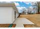 Backyard featuring a newly installed concrete patio and pristine white siding at 1200-1 Stanton Dr, Shelby, NC