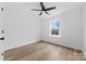 Bright bedroom with ceiling fan, window and luxury vinyl plank flooring at 1200-1 Stanton Dr, Shelby, NC