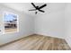 Bright bedroom with ceiling fan, window and luxury vinyl plank flooring at 1200-1 Stanton Dr, Shelby, NC