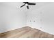 A modern bedroom with a ceiling fan, closet, and neutral color scheme at 1200-1 Stanton Dr, Shelby, NC