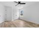 A modern bedroom with a ceiling fan, large closet, and neutral color scheme at 1200-1 Stanton Dr, Shelby, NC