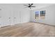 Spacious bedroom with two windows, ceiling fan, and vinyl plank flooring at 1200-1 Stanton Dr, Shelby, NC