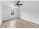 Light-filled bedroom featuring a ceiling fan and a window for natural light at 1200-1 Stanton Dr, Shelby, NC