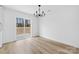 Bright dining area with modern chandelier and sliding glass door to backyard at 1200-1 Stanton Dr, Shelby, NC