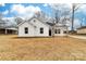 Charming white home with dark trim, manicured lawn, and inviting front porch at 1200-1 Stanton Dr, Shelby, NC