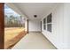 Welcoming front porch with natural wood columns and ample space at 1200-1 Stanton Dr, Shelby, NC