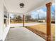 Beautiful front porch with natural wood columns and ample space for outdoor seating at 1200-1 Stanton Dr, Shelby, NC