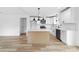 A well-lit kitchen showcasing a center island, white cabinets, and stainless steel appliances at 1200-1 Stanton Dr, Shelby, NC