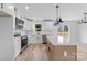 Modern kitchen featuring white cabinets, stainless steel appliances, and a kitchen island with a white countertop at 1200-1 Stanton Dr, Shelby, NC