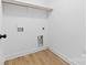 Modern laundry room with hookups and vinyl plank flooring at 1200-1 Stanton Dr, Shelby, NC