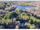 Aerial view of home near lake, showcasing surrounding nature at 121 Sierra Woods Dr, Troutman, NC 28166