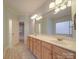 Elegant bathroom with double vanity, large mirror, and tiled floor at 121 Sierra Woods Dr, Troutman, NC 28166