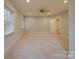 Bright bedroom featuring carpet, ceiling fan and window with blinds at 121 Sierra Woods Dr, Troutman, NC 28166