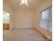 Bedroom with carpet, window with blinds, and access to bathroom at 121 Sierra Woods Dr, Troutman, NC 28166