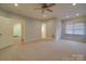 Spacious bedroom with carpeted floor, ceiling fan, and window with blinds at 121 Sierra Woods Dr, Troutman, NC 28166