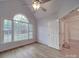 Spacious bedroom with hardwood floors, vaulted ceiling and large window at 121 Sierra Woods Dr, Troutman, NC 28166