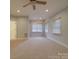 Large bedroom with neutral walls and carpet flooring at 121 Sierra Woods Dr, Troutman, NC 28166