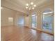 Formal dining room with hardwood floors, chandelier, and large windows at 121 Sierra Woods Dr, Troutman, NC 28166