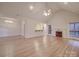 Living room with hardwood floors, fireplace, and high ceilings at 121 Sierra Woods Dr, Troutman, NC 28166