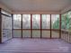 Screened porch overlooking wooded backyard at 121 Sierra Woods Dr, Troutman, NC 28166