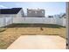 Backyard with a patio and a white privacy fence at 13502 Tartarian Ct, Charlotte, NC 28215