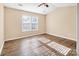 Spacious bedroom with wood-look floors and large windows at 13502 Tartarian Ct, Charlotte, NC 28215