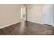 Bedroom with wood-look floors and access to bathroom at 13502 Tartarian Ct, Charlotte, NC 28215