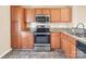 Kitchen with granite countertops and stainless steel appliances at 13502 Tartarian Ct, Charlotte, NC 28215