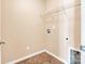 Laundry room with shelving and floor tile at 13502 Tartarian Ct, Charlotte, NC 28215