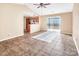 Living room with sliding glass doors and tile floors at 13502 Tartarian Ct, Charlotte, NC 28215