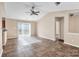 Living room with vaulted ceiling and tile floors at 13502 Tartarian Ct, Charlotte, NC 28215