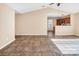 Open concept living room with tile floors and kitchen views at 13502 Tartarian Ct, Charlotte, NC 28215