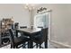 Breakfast nook with four chairs and view to backyard at 13883 Clayborn St, Midland, NC 28107