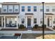 Three-unit townhome building, light gray exterior, front porches, landscaping at 13883 Clayborn St, Midland, NC 28107