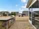 Outdoor kitchen and patio with backyard and community views at 1410 Tranquility Blvd, Lancaster, SC 29720