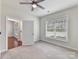 Spacious bedroom with large window and access to another room at 1410 Tranquility Blvd, Lancaster, SC 29720