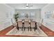 Bright dining room with hardwood floors and seating for six at 1410 Tranquility Blvd, Lancaster, SC 29720