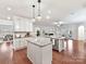 Open concept kitchen with large island and hardwood floors at 1410 Tranquility Blvd, Lancaster, SC 29720