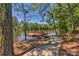 Wooden lake dock with pathway, offering serene waterfront access at 1410 Tranquility Blvd, Lancaster, SC 29720