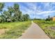 Walking path through a green space with trees at 153 Crownpiece St, Troutman, NC 28166