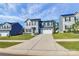 Two-story house with gray siding, black shutters, and a two-car garage at 153 Crownpiece St, Troutman, NC 28166